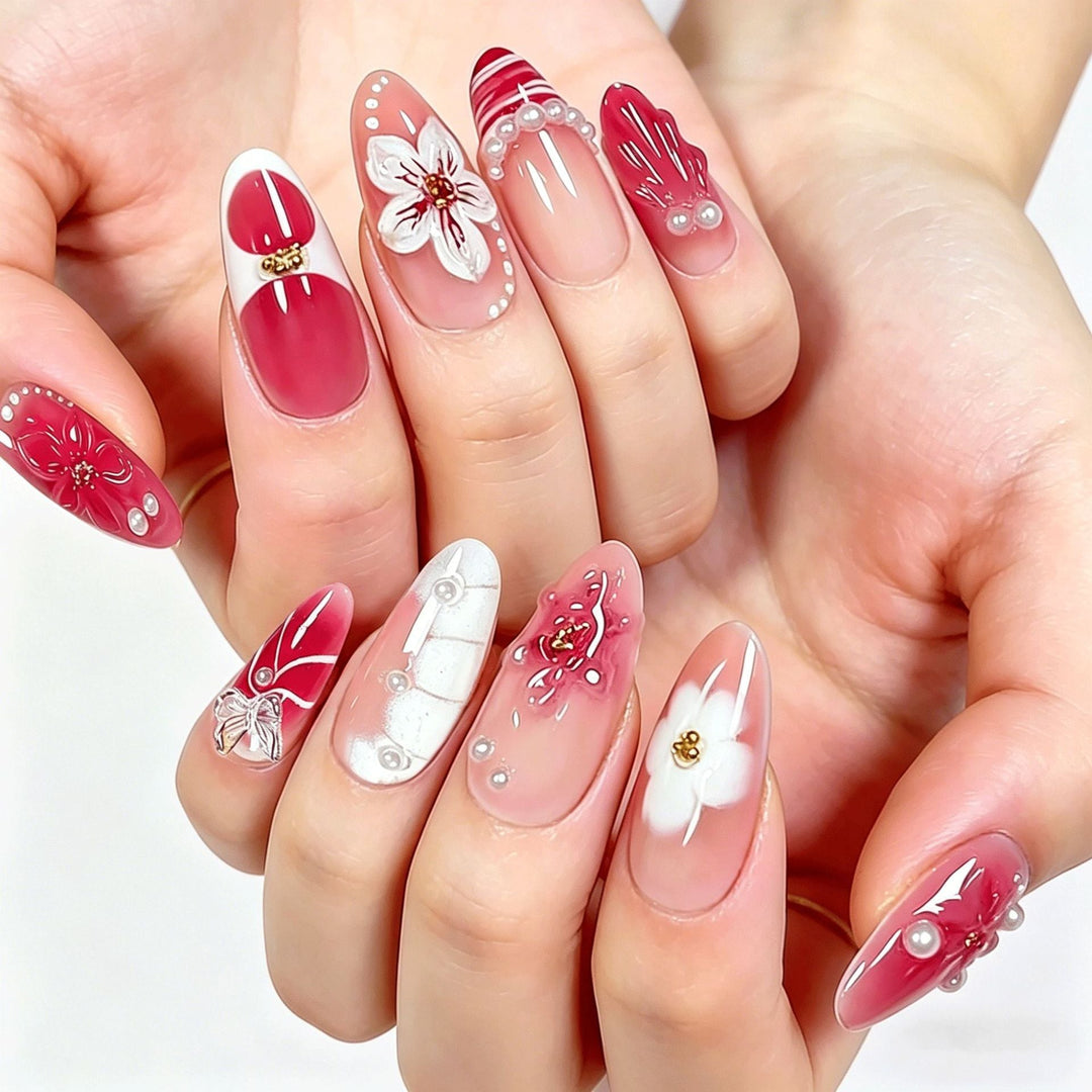 Women's press-on nails with intricate floral art. Decorative false nails for an elegant, quick beauty manicure.