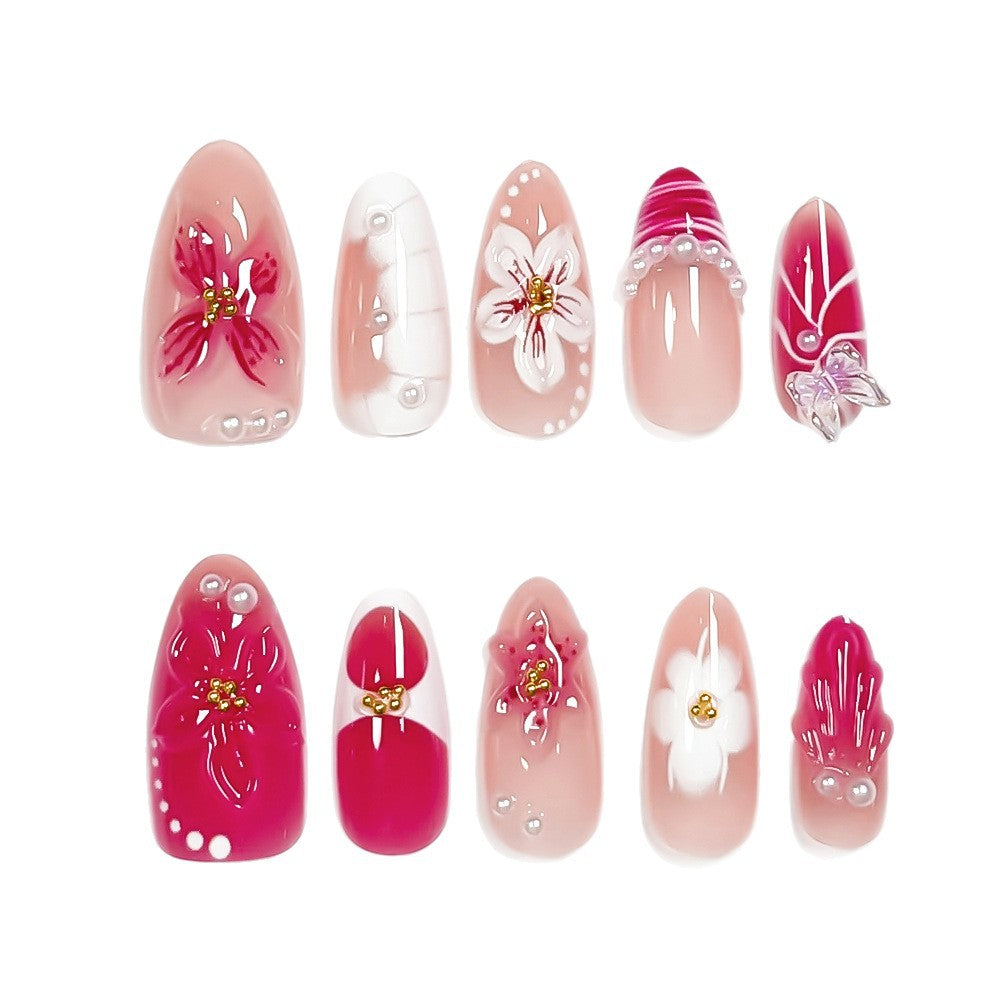 Stylish women's floral press-on nails. Decorative false nails with elegant flower art for a beautiful manicure.