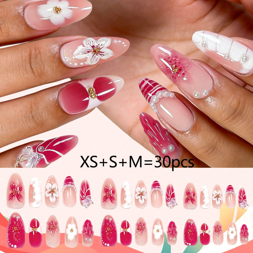 Women's press-on nails, elegant floral design. Instant false nail art for a beautiful, decorative manicure.