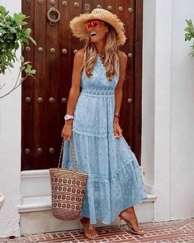 Flowy A-line women's maxi dress with vibrant print, sleeveless, V-neck. Ideal for spring and summer elegance.