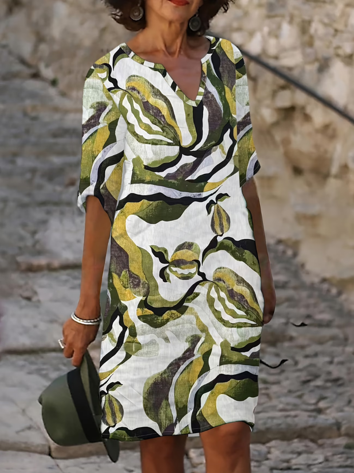 Elegant women's printed summer dress, knee-length & flowy for effortless comfort and style.