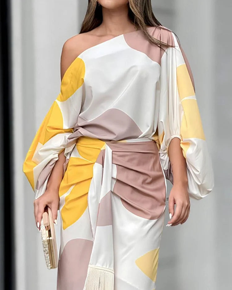 Vibrant women's printed two-piece set with elegant midi style, versatile spring & summer fashion statement.