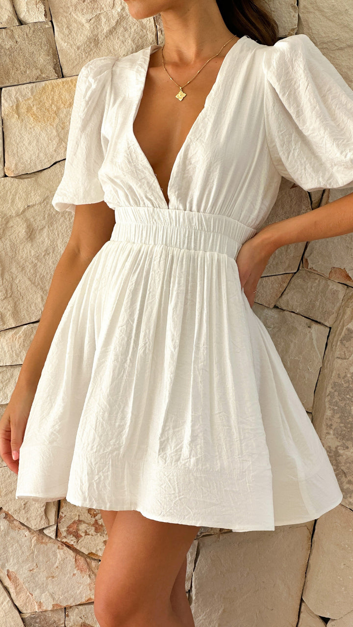 Stylish women's puff sleeve mini dress. Chic short dress for spring parties, casual outings & daily wear.