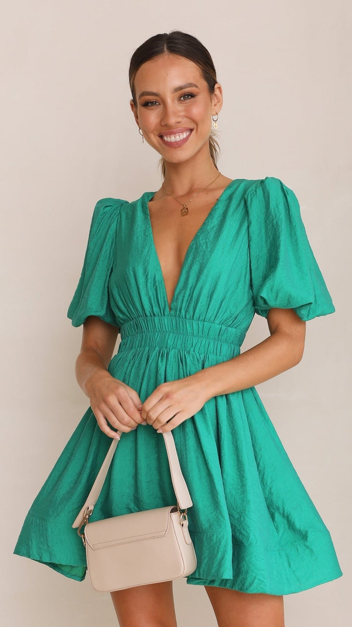Versatile women's puff sleeve mini dress. Chic spring fashion, suitable for elegant parties or casual daily wear.