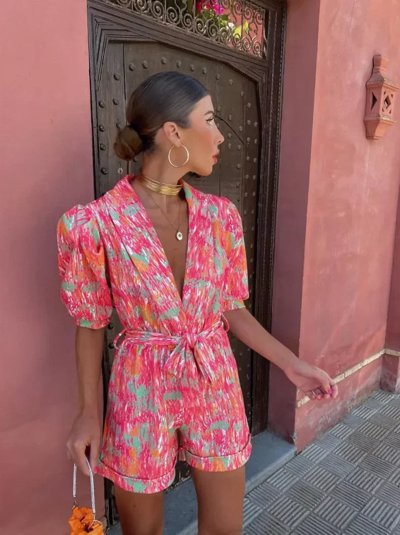 Close-up of the stylish belt on a women's puff sleeve romper, suitable for a special occasion.