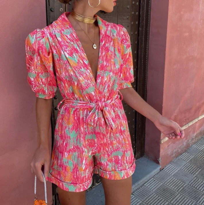 Comfortable & stylish pink puff sleeve romper for women, perfect for elegant party or special occasion wear.