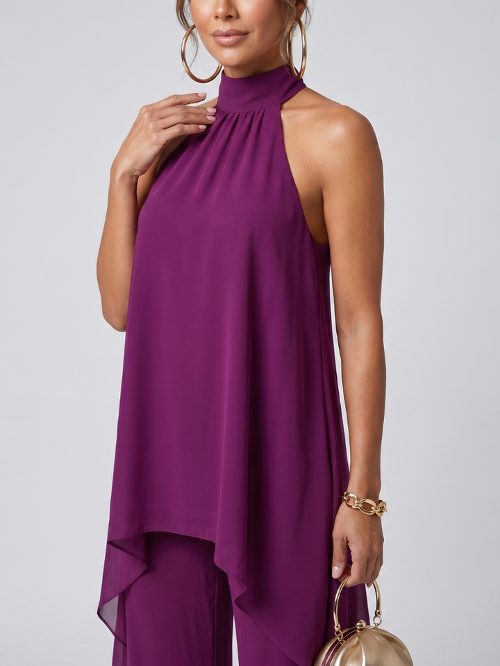 Halter neck asymmetric tunic top & wide leg pants. Flowing purple two-piece set for women's elegant summer fashion.