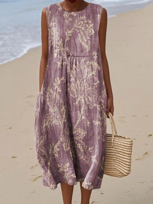 Elegant women's purple floral sleeveless midi dress. Perfect for versatile style and comfortable wear this spring or summer.