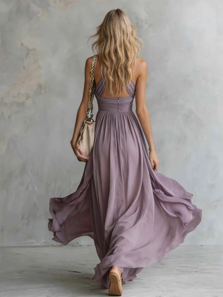 Stylish women's purple maxi dress with ruched halter neck & flowing skirt, suitable for formal and summer occasions.