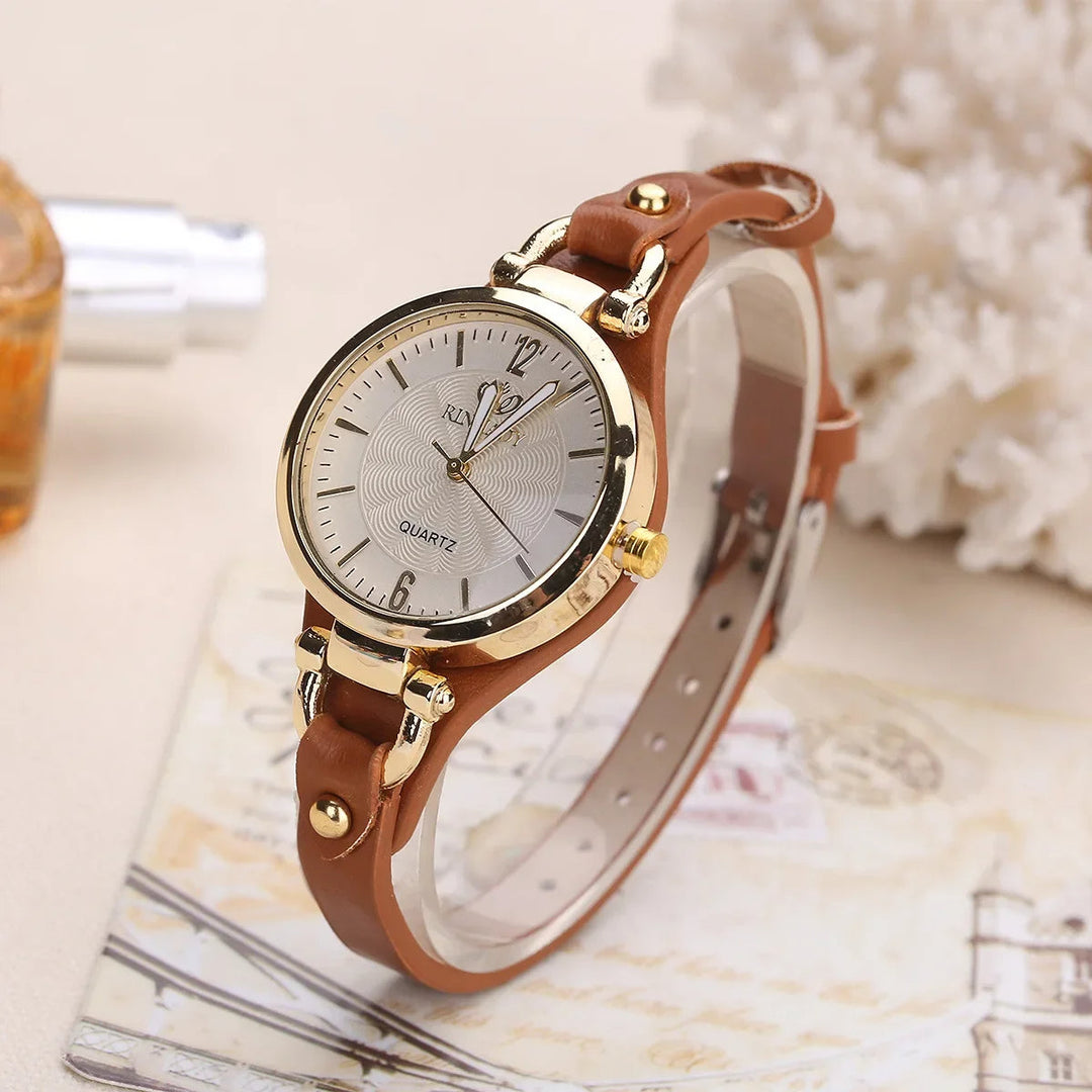 Elegant women's quartz watch with sophisticated engraved dial and stylish vegan leather strap.