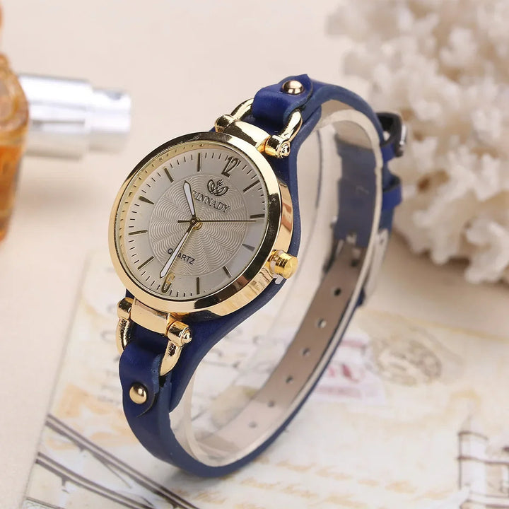 Classic ladies' wrist watch featuring a unique engraved dial and comfortable black vegan leather strap.
