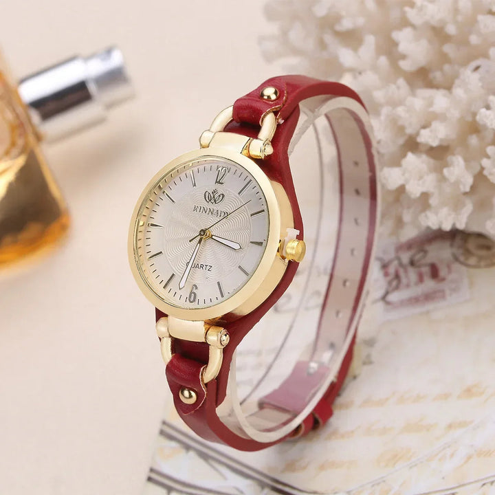 Minimalist women's fashion watch, round engraved dial, and cruelty-free vegan leather band.