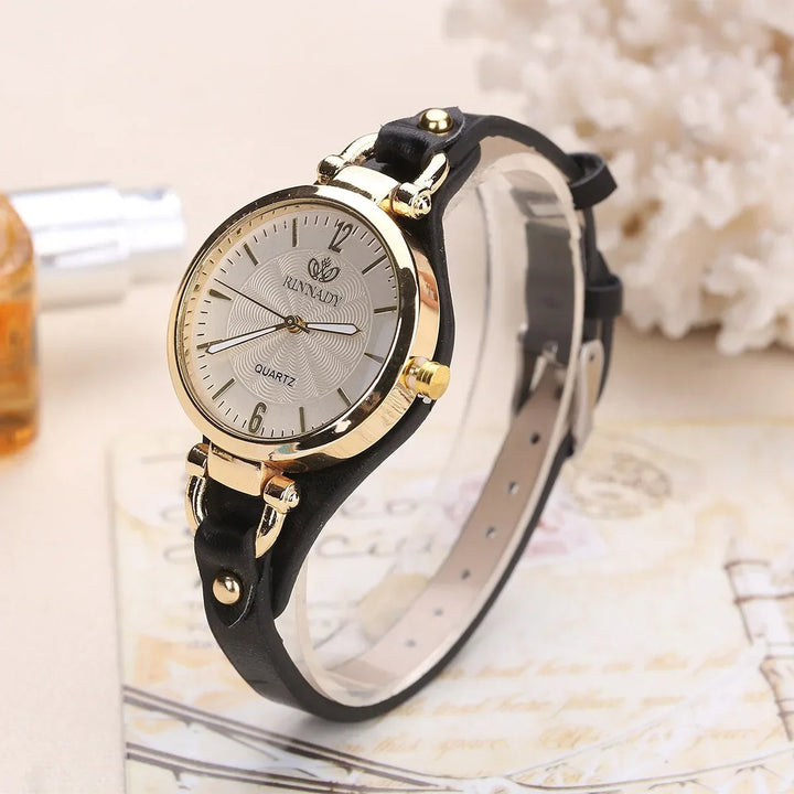 Elegant women's watch with engraved dial and soft brown vegan leather strap, perfect for daily wear.