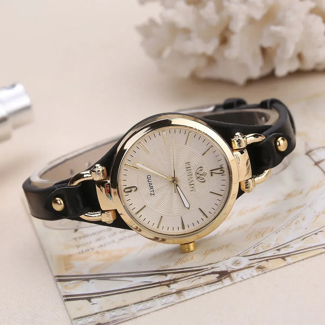 Ladies' quartz watch, detailed engraved dial, and smooth vegan leather strap for an elegant look.