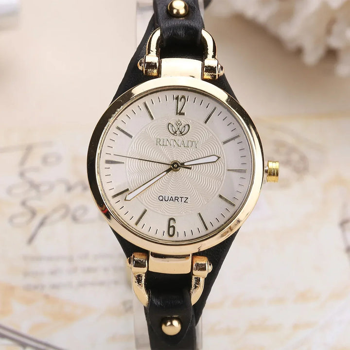 Modern women's wrist watch featuring an engraved dial, precise quartz movement, and vegan leather strap.
