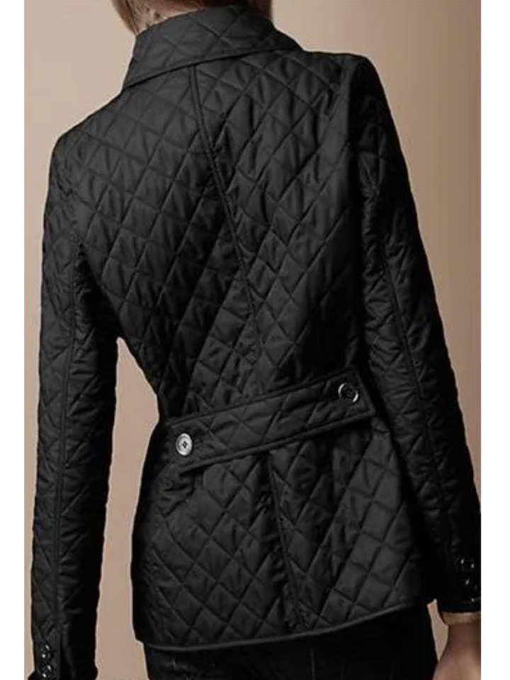 Comfortable women's quilted jacket with snap button closure & turned-down collar. Ideal for winter layering & fall.
