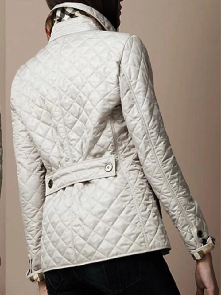 Warm quilted women's jacket, elegant turned-down collar. Cozy casual outerwear, great for everyday fall/winter comfort.