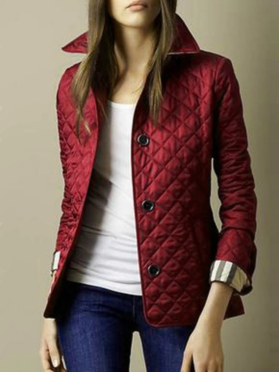 New women's quilted jacket with elegant turned-down collar. A warm, comfortable layering piece for fall/winter fashion.