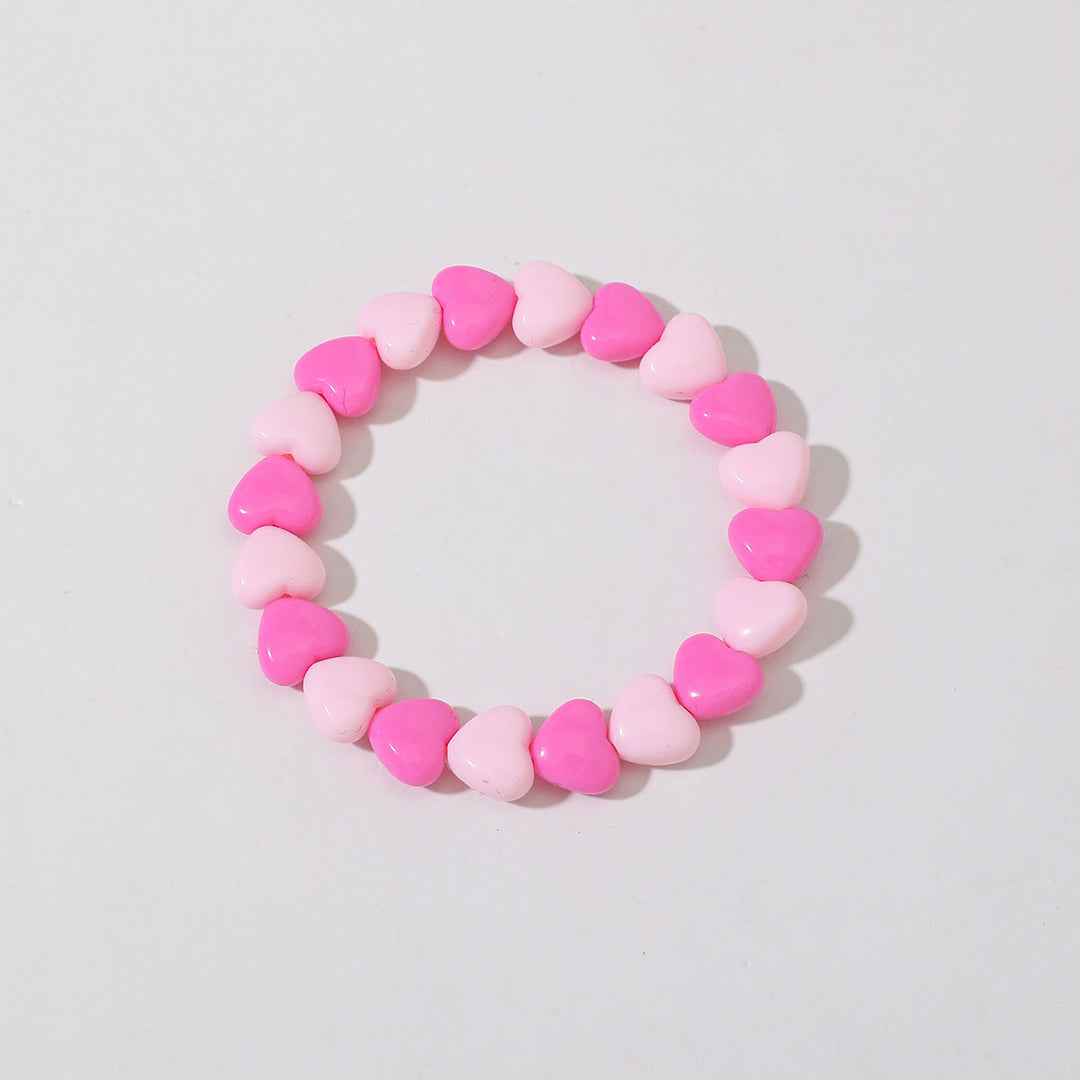 Classic red crystal bead bracelet for women, simple yet elegant heart charm design.