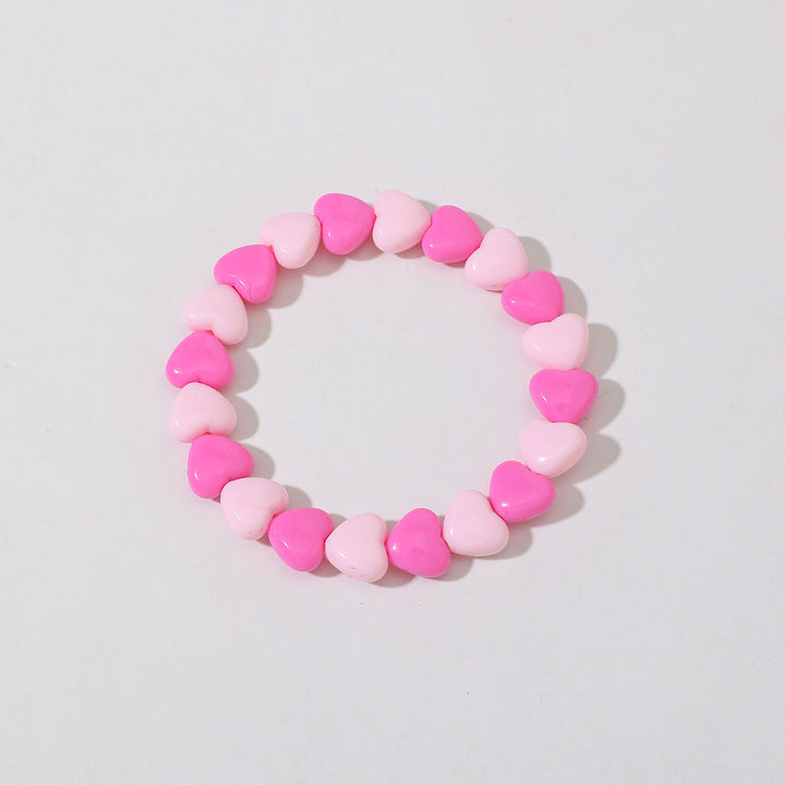 Classic red crystal bead bracelet for women, simple yet elegant heart charm design.