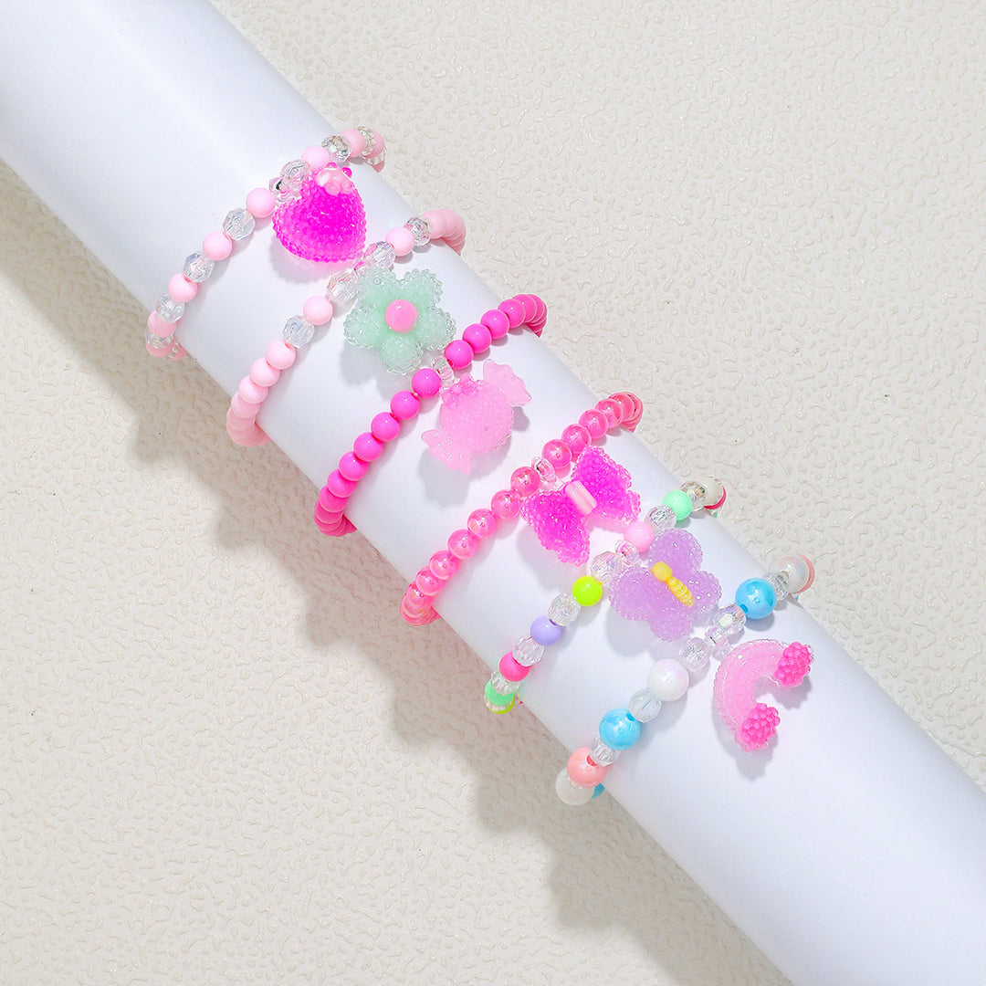 Women's elastic bead bracelet, vibrant red crystal beads and an elegant heart charm.
