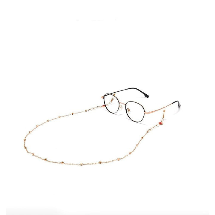 Elegant women's red glasses chain with heart & pearl pendants. Stylish eyewear holder & fashion accessory.