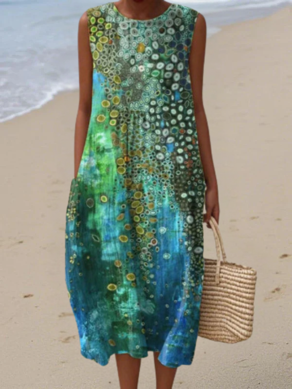 Elegant women's reef print sleeveless midi dress. Ocean-inspired, flowy, multicolor, perfect for summer casual wear.