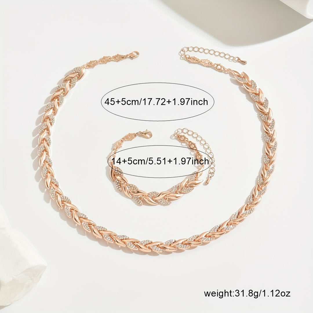 Women's fashion jewelry: silver rhinestone fish tail necklace with matching bracelet.