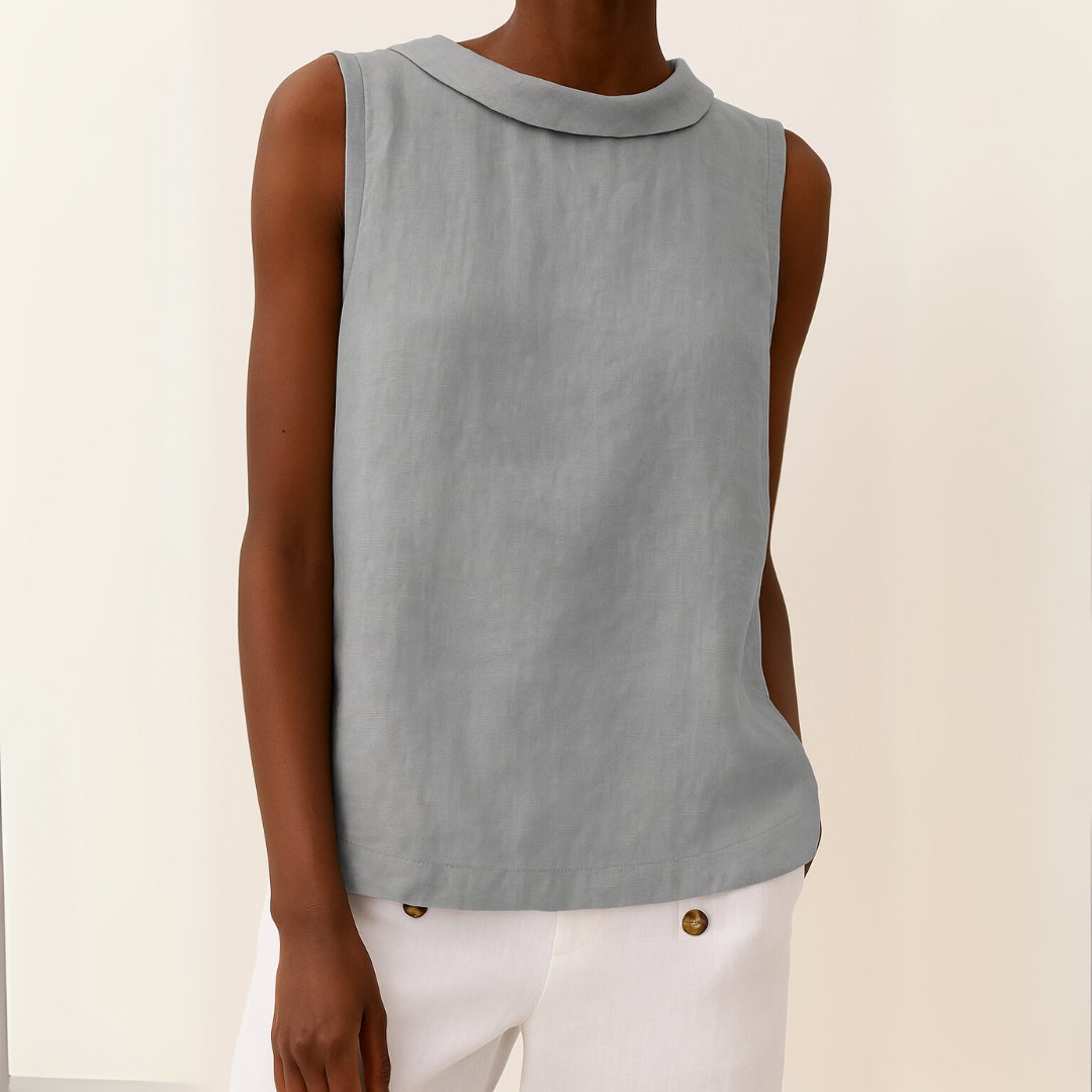 Elegant women's roll neck sleeveless blouse, perfect for smart casual or workwear. Chic and versatile top.