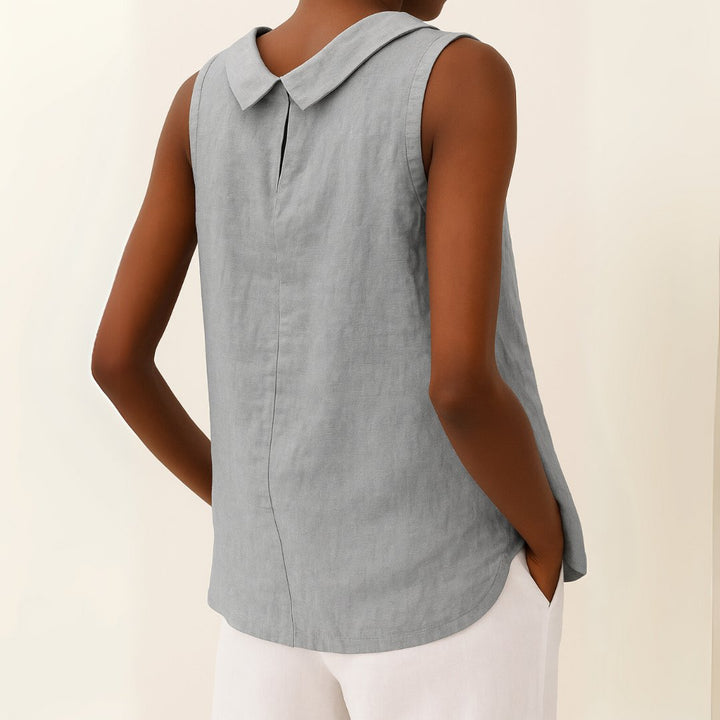 Versatile women's sleeveless blouse with a stylish roll neck. Ideal for summer and daytime wear.