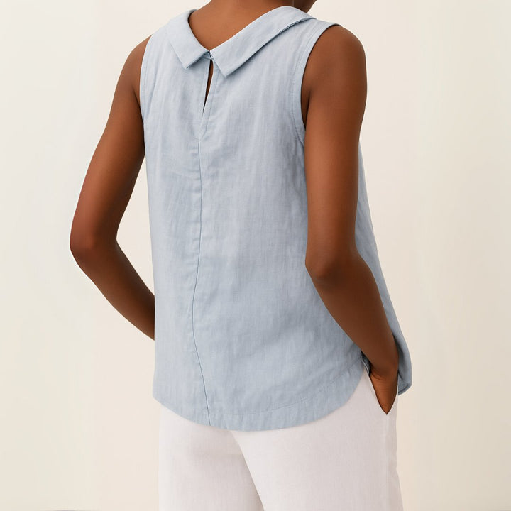 Women's elegant roll neck sleeveless top, suitable for office wear or sophisticated casual outfits.