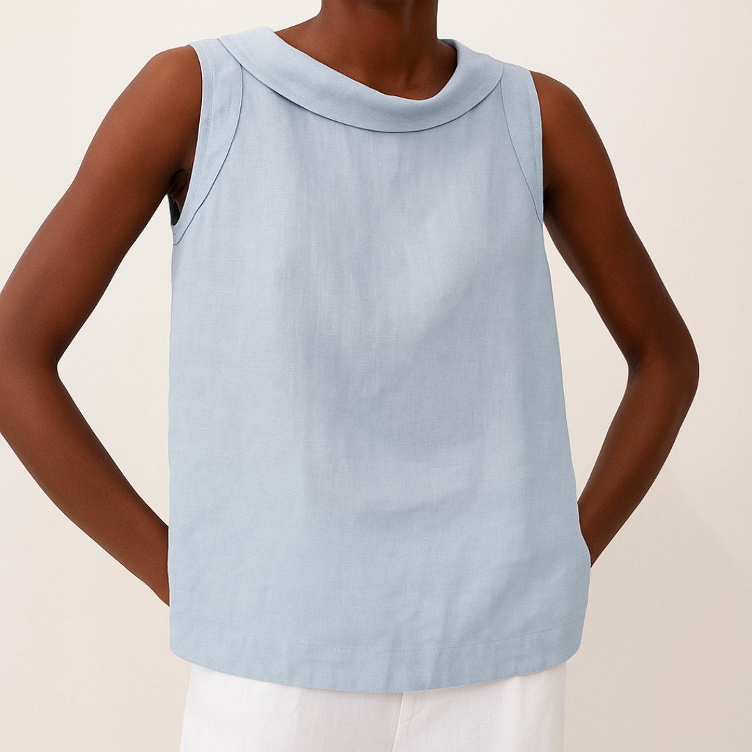 Relaxed fit women's sleeveless roll neck blouse. A versatile, chic top for elegant summer and work outfits.