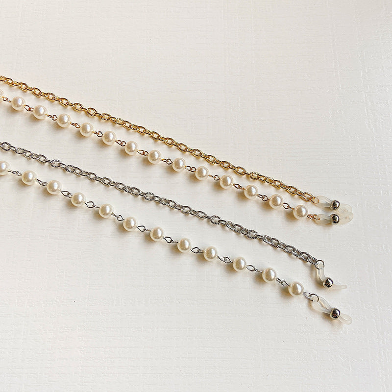 Luxury women's fashion glasses frame featuring a delicate pearl chain, combining style with elegant eye protection.