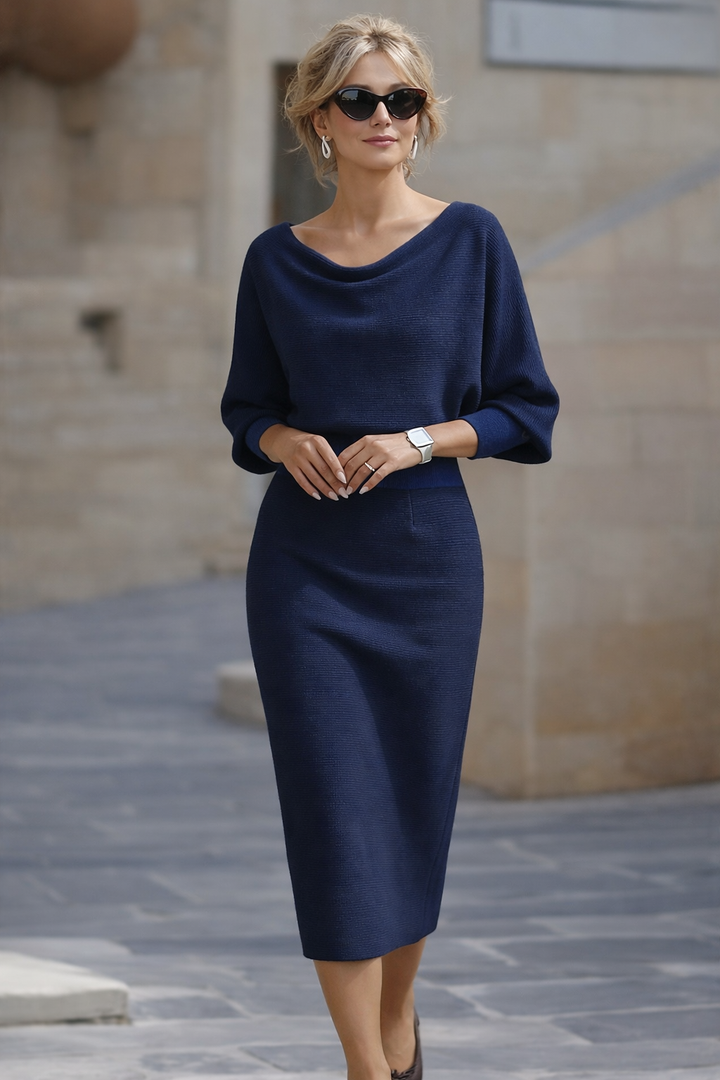 Elegant women's round neck midi dress with flowy batwing sleeves, perfect for casual or occasion wear.