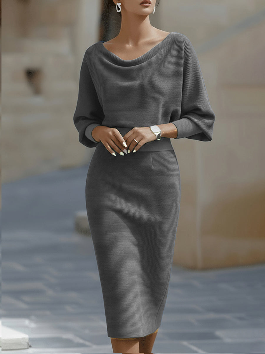 Women's flowy midi dress with a round neck and elegant batwing sleeves, offering comfort & style.