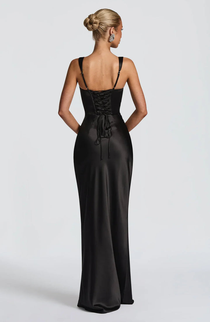 Women's summer fashion: Sleeveless maxi dress featuring a chic ruched waist and adjustable lace-up back detail.