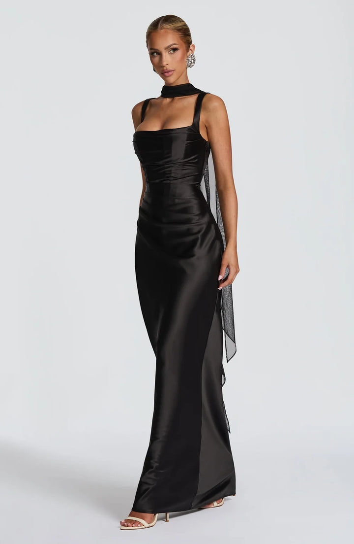 Flowy women's summer maxi dress with a flattering ruched waist & trendy lace-up back. Great for any occasion.