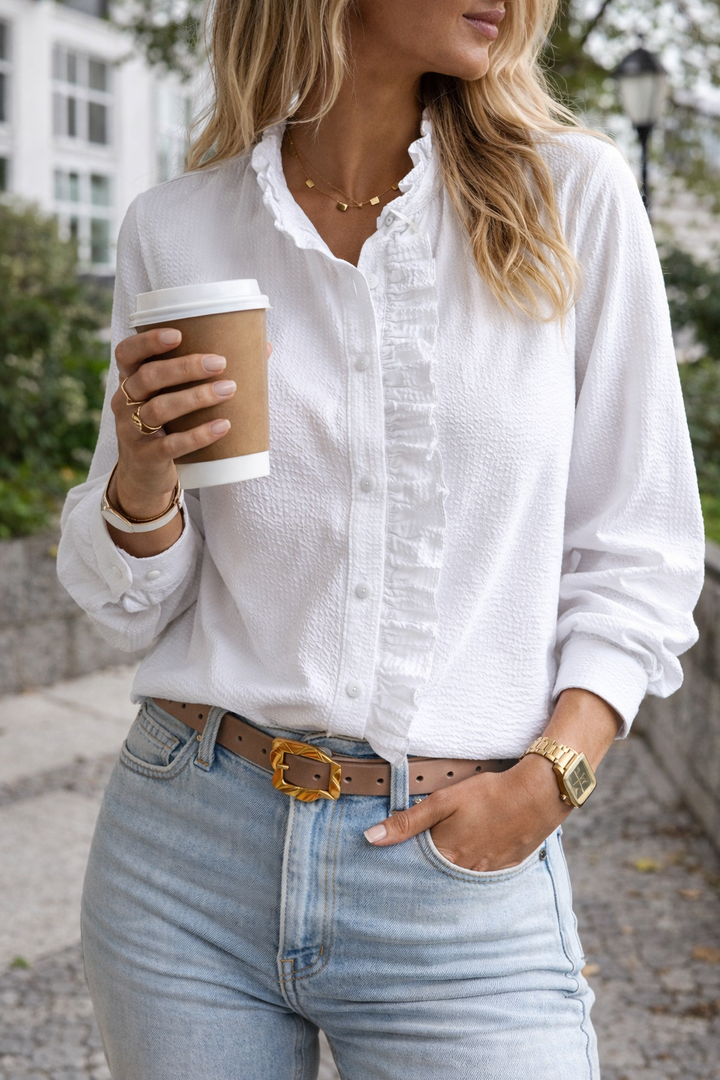 Pink women's ruffle button blouse. Feminine and elegant, this button-front top is perfect for smart casual wear.