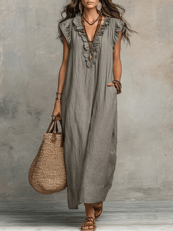 Chic flowy sleeveless midi dress for women, ideal for casual summer days, vacation wear & parties.