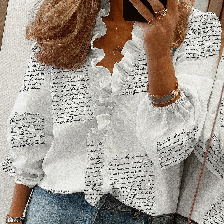 Sophisticated women's slim fit blouse featuring ruffle trim, puff sleeves, and versatile style.