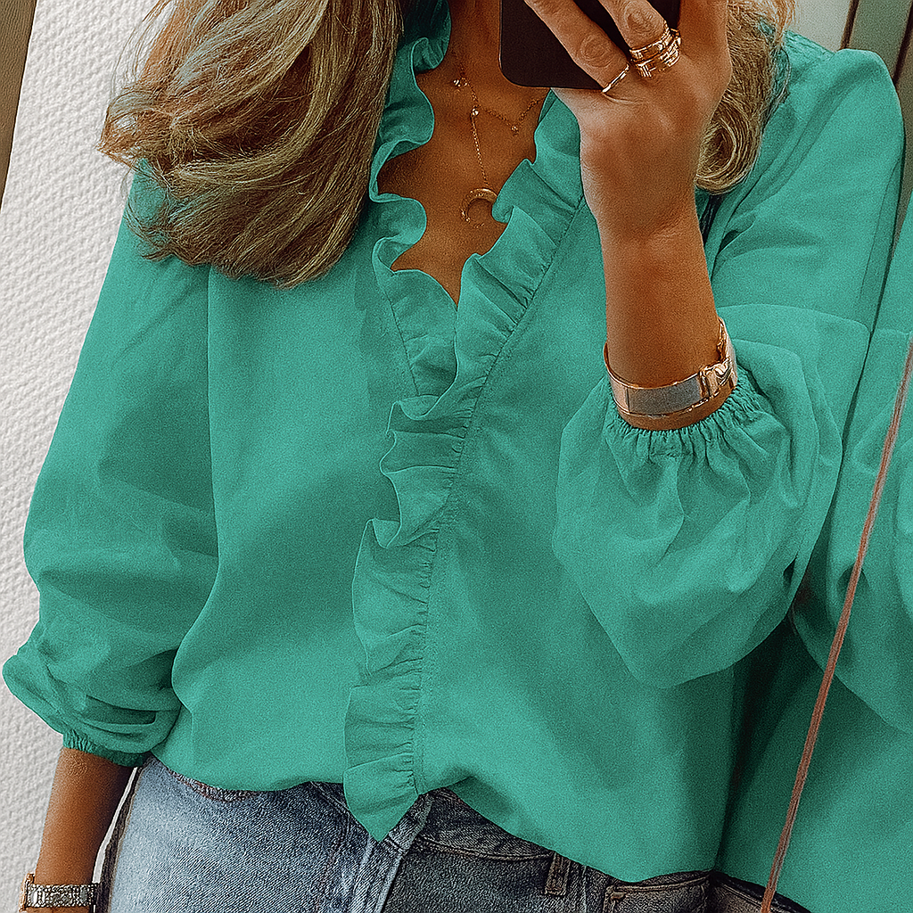 Women's formal top with elegant puff sleeves, delicate ruffle trim, and a flattering V-neck.