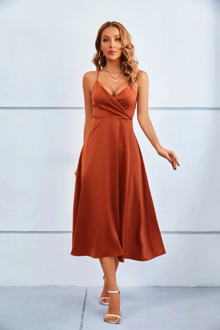 Elegant women's rust bodycon midi dress with V-neck, perfect for evening or cocktail parties. Features adjustable straps.