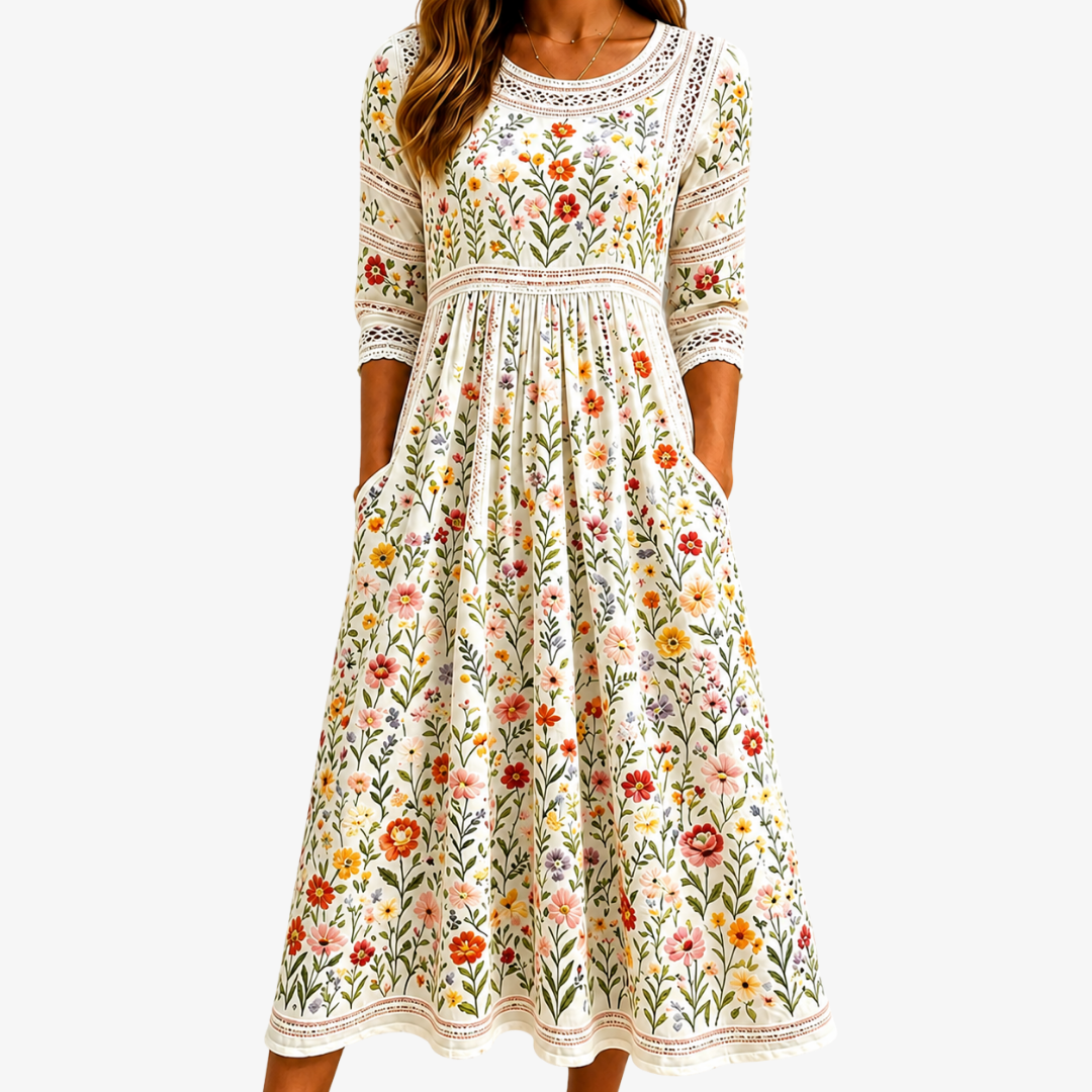 Elegant women's sage green midi dress with wildflower floral print, an A-line flowy design for comfortable summer style.