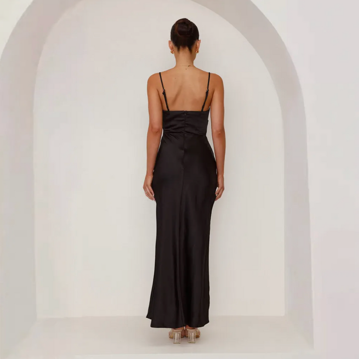 Chic black women's evening gown with a silky satin look, elegant ruching, & a dramatic side split.