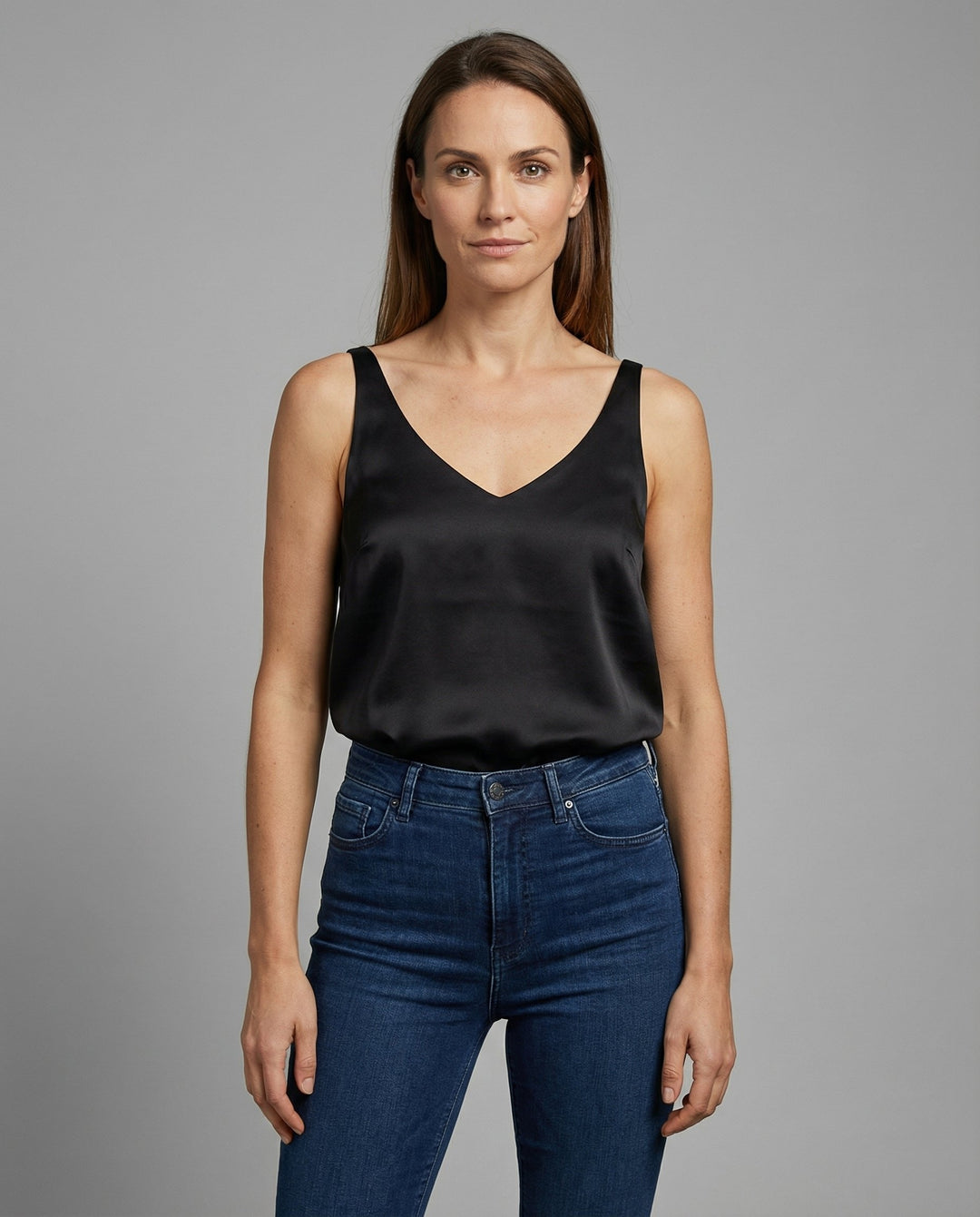 Elegant women's satin V-neck camisole top with wide straps, perfect for dressy occasions or day-to-night wear.