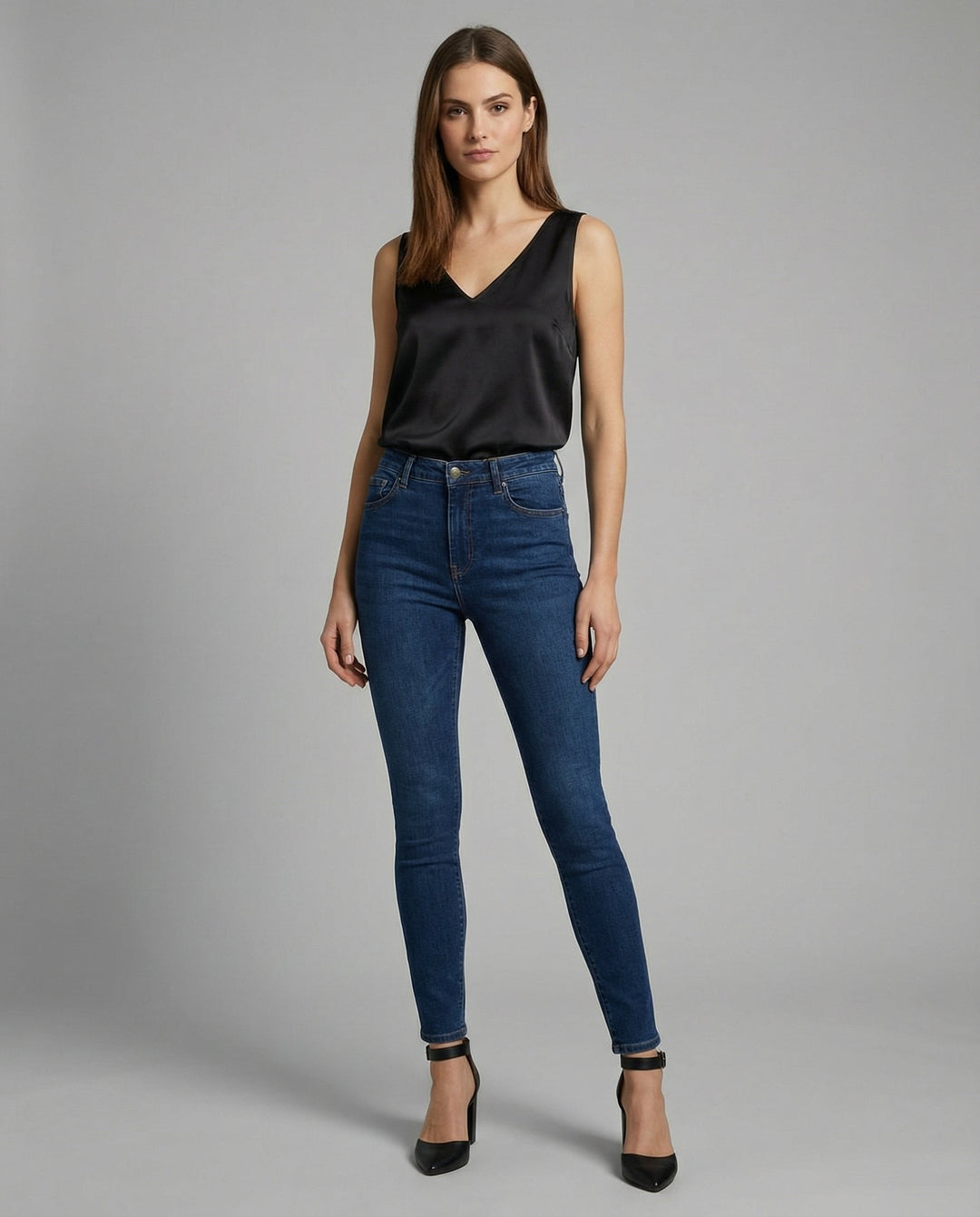 Stylish women's V-neck camisole top, featuring wide straps and a luxurious satin finish for versatile fashion.