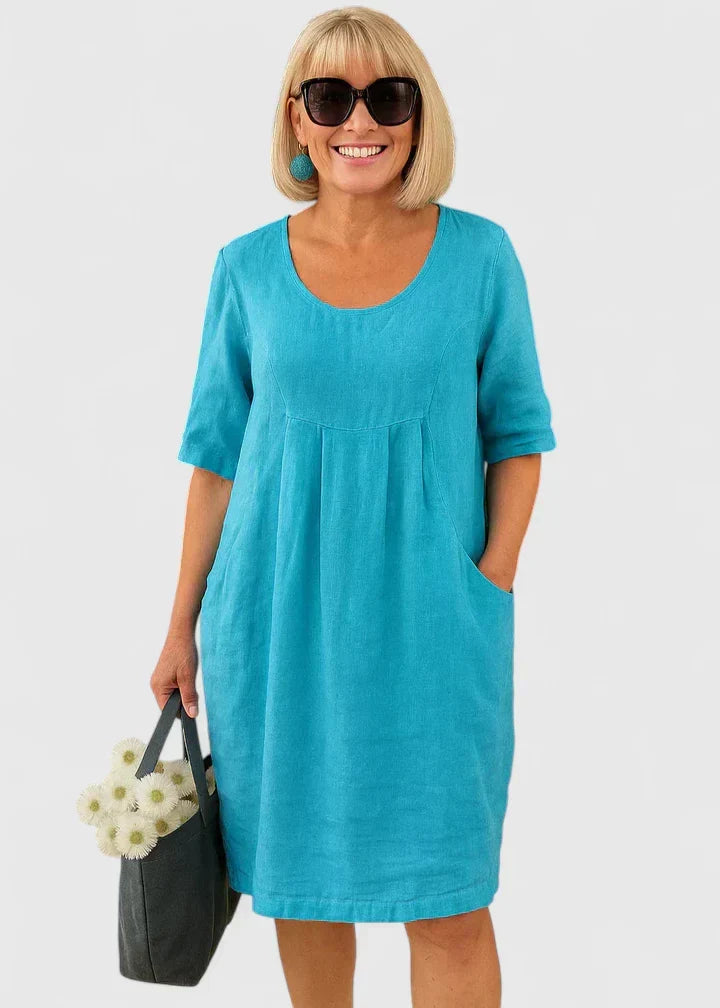 Chic women's elegant dress: scoop neck, half sleeve, and convenient pockets. Ideal for casual to everyday wear.