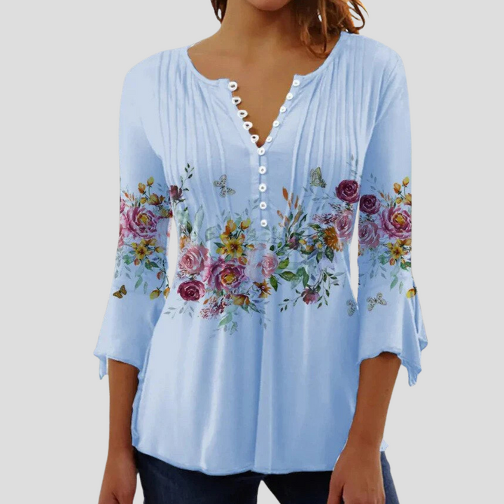 Sophisticated women's top with a flattering fit. This elegant semi-fitted blouse is great for office and casual.