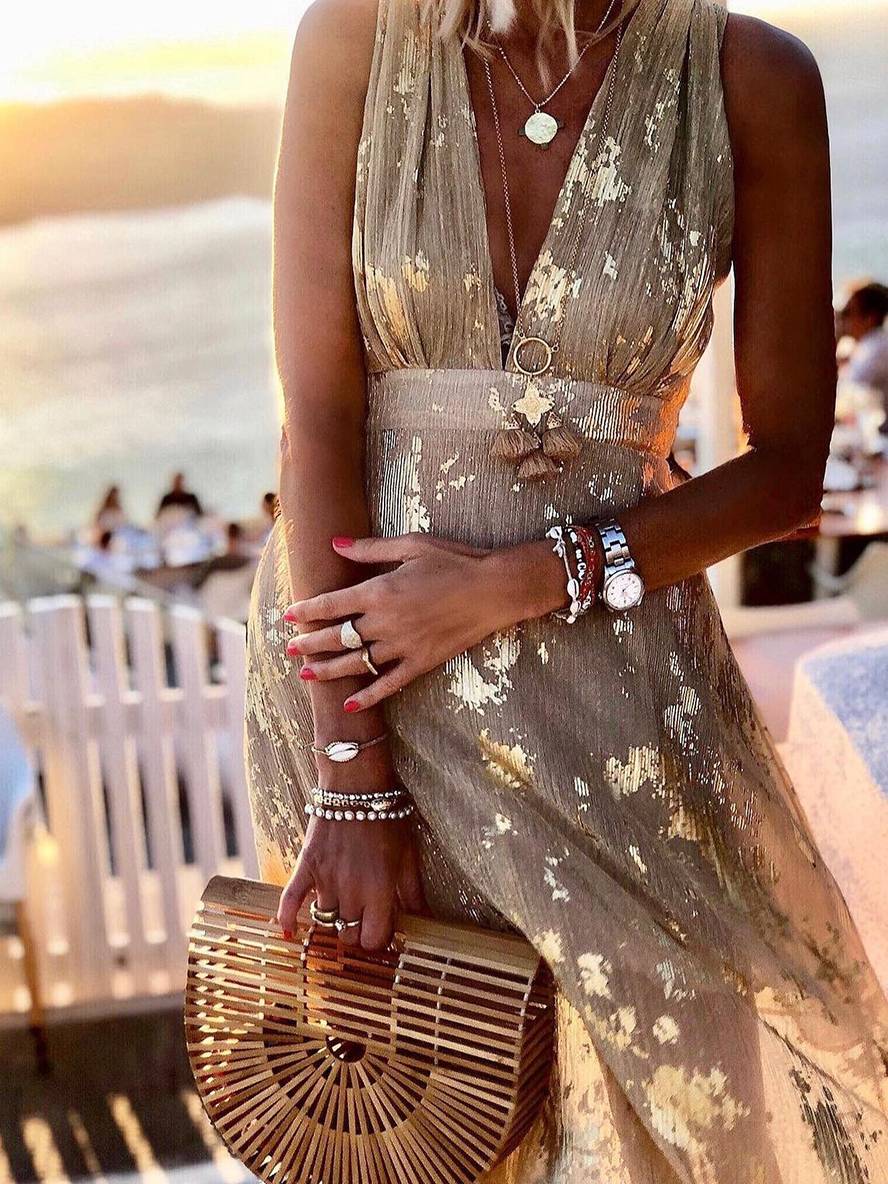 V-neck sleeveless women's sequin maxi dress. Glamorous formal wear, perfect as a party dress or evening gown.