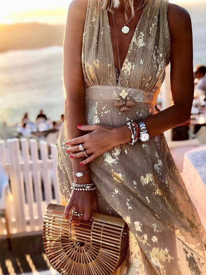 V-neck sleeveless women's sequin maxi dress. Glamorous formal wear, perfect as a party dress or evening gown.